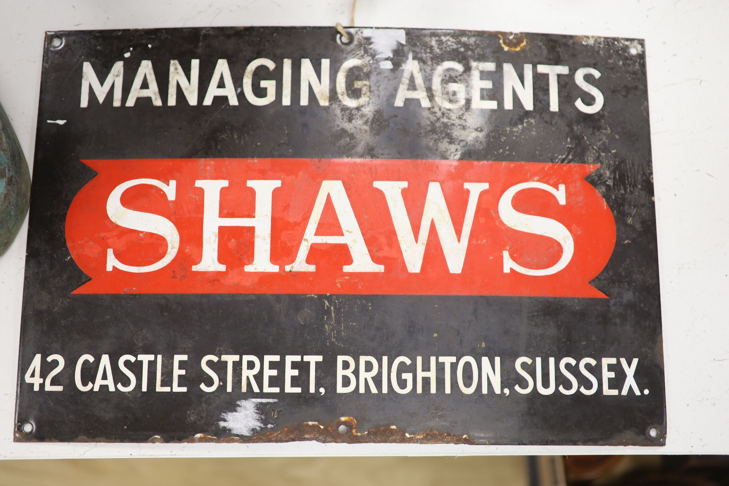 An enamel sign Shaws Managing Agents, 46 x 30cm